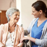 Shot of a young nurse caring for a senior woman in a retirement home