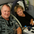 Mesothelioma survivor Doug Jackson and wife Cindy on plane