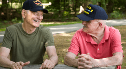 two war veterans smiling