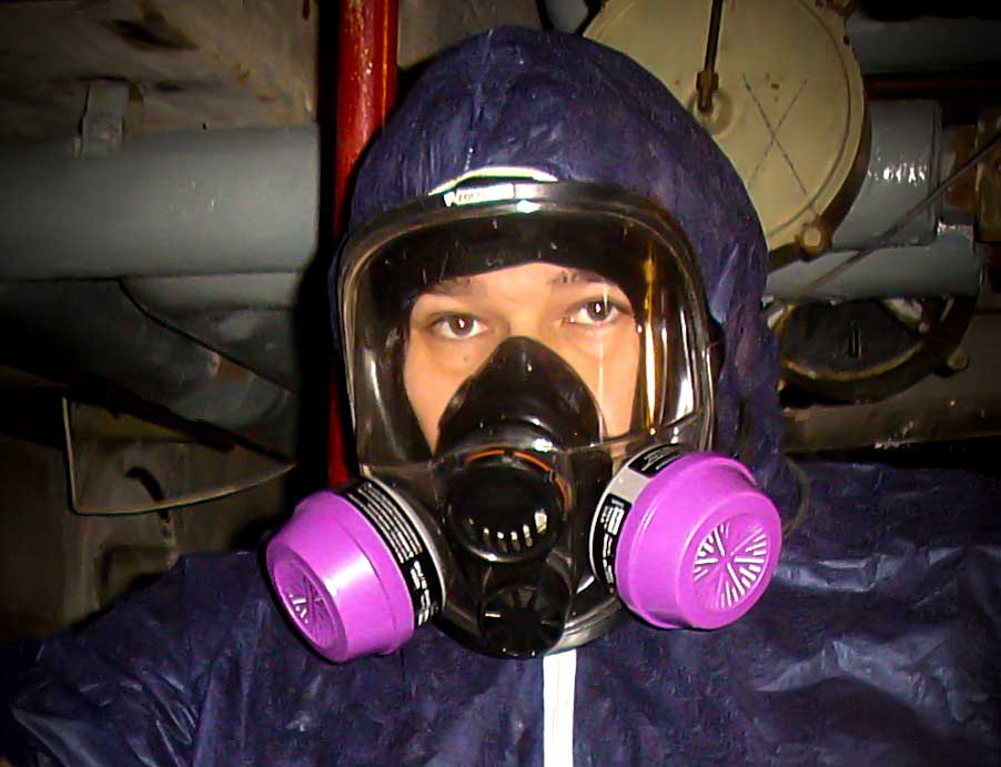 Asbestos hunter Anthony Rich in a protective suit