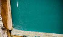 asbestos cement spacer behind chalkboard