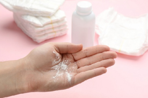 dusting powder on pink background