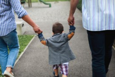 Family walking with a child