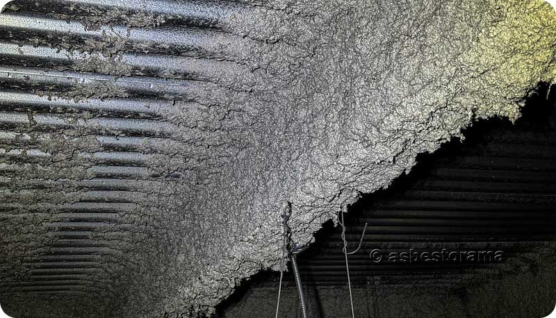 Asbestos-containing fireproofing spray