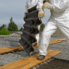 Workers safely remove asbestos from building