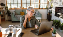 Woman using laptop at home