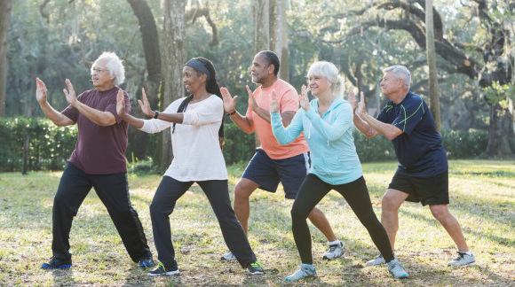 Mesothelioma patients practicing tai chi in a park