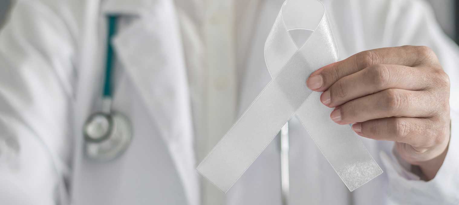 Mesothelioma ribbon held up by doctor