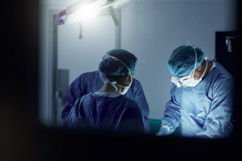 Doctors in a hospital performing surgery.