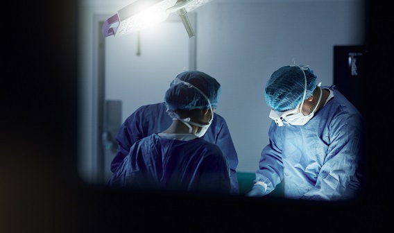 Doctors in a hospital performing surgery.